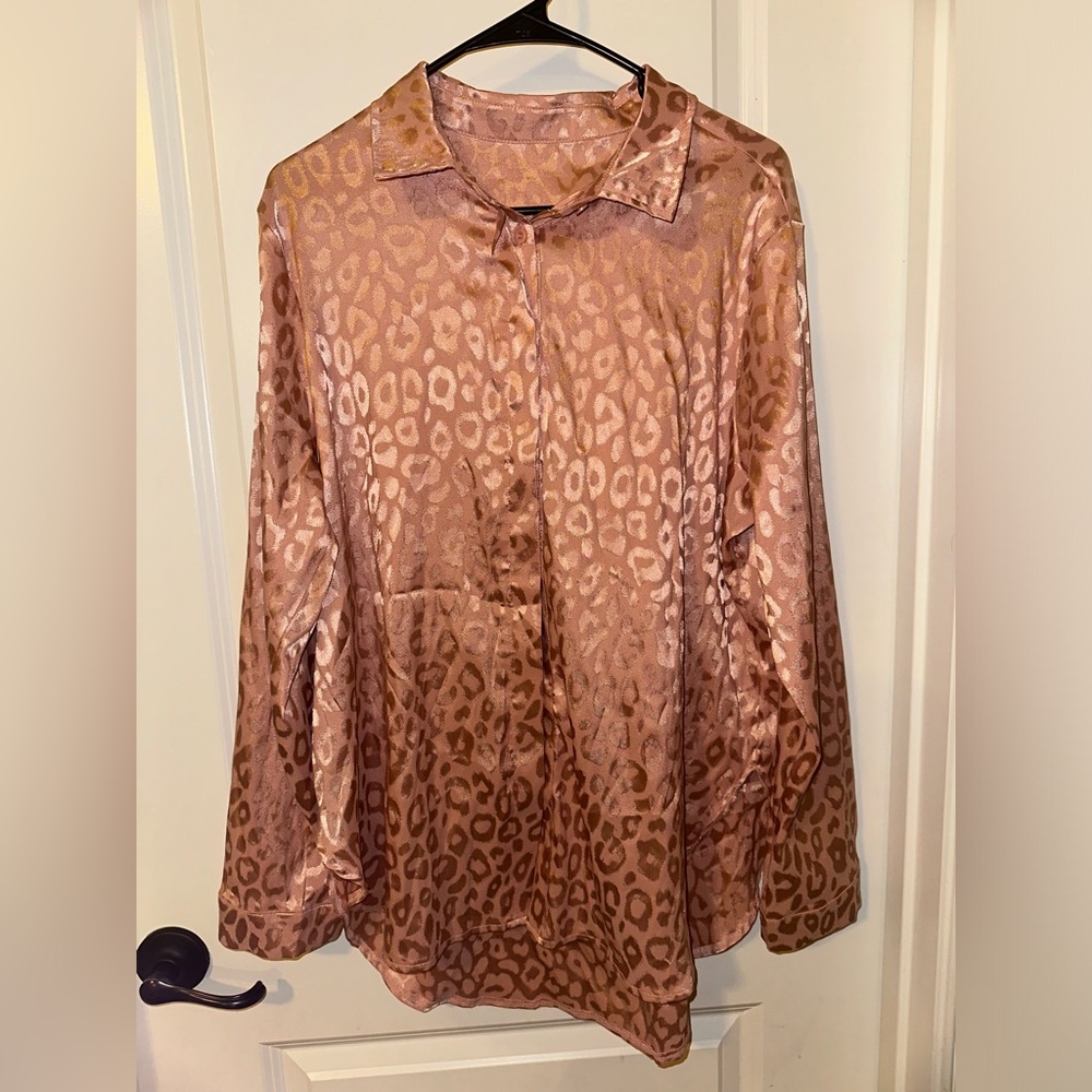 Pink silk cheetah print button down blouse
Size Large